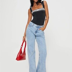 Black and White Tank Top with Blue Jeans